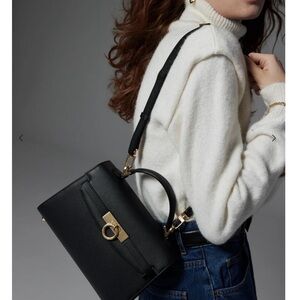 Chic Black Crossbody Bag with Gold Accents